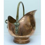 A copper and brass coal scuttle