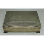 A silver Arts and Crafts cigarette box, Birmingham 1931, total weight 471.