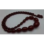 Sherry amber coloured beads, 63.