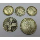 An 1887 half crown, an 1888 shilling, an 1887 shilling,