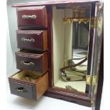 A jewellery cabinet and jewellery
