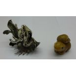 A squirrel netsuke and a white metal dragon's head,