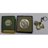 Three silver fobs and two silver medals, boxed, 121.