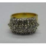 An 18ct gold and diamond ring, set with nineteen diamonds, 9.