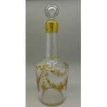 A French glass decanter with gilt decoration, stopper a/f,