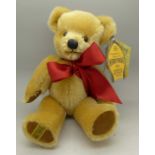 A Merrythought Teddy bear with labels and box