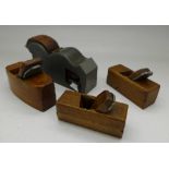 Four miniature woodworking planes including bullnose