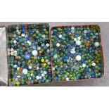 Two tins of marbles