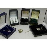 Silver jewellery including a locket and rings