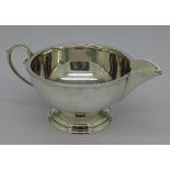 A J. Gloster silver cream jug, Birmingham 1935, 101.