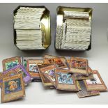 Two collectors tins of Yu-Gi-Oh! trading cards