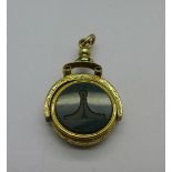 A Victorian yellow metal swivel fob