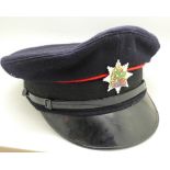 A fireman's uniform cap with Nottinghamshire badge