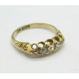 An 18ct gold, five stone diamond ring, 3.
