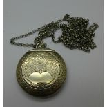 A silver compact or locket on a white metal chain, Birmingham 1919,