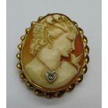 A 10k gold mounted cameo brooch set with an old cut diamond, total weight 7.