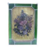 A leaded light with central design of a bouquet of flowers,