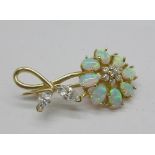 A 14ct gold, synthetic opal and clear stone brooch, 6.