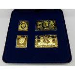 A Danbury Mint Royal House of Windsor Coronation Stamp Collection in silver ingot form,