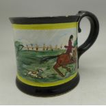 A studio pottery mug with hunting scene,