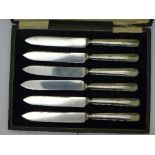 A set of six silver handled knives,