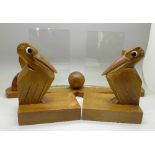 An Art Deco wood and glass photograph frame and a pair of pelican book ends