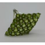 A large silver and peridot ring,