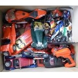 A collection of model vehicles including Burago and motorcycles