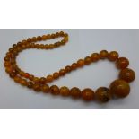 An amber coloured necklet,