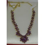 A silver gilt and amethyst necklace