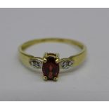 A 9ct gold and garnet ring, 1.