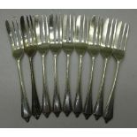 A set of nine silver cake forks, 132.