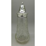 A silver topped glass sugar caster,