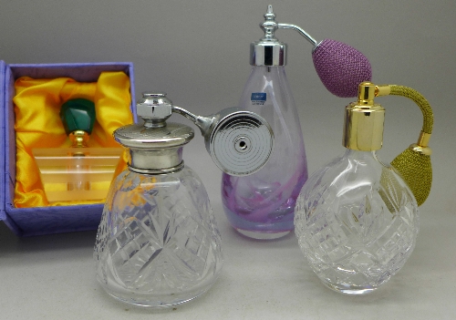 Four perfume bottles including Royal Doulton and Caithness