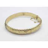 A 9ct gold bangle, 10.