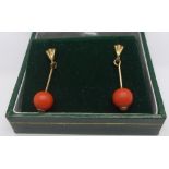 A pair of 9ct gold and coral drop earrings