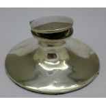 A silver capstan inkwell,