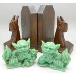 A pair of oak bookends with stylised dogs and a pair of dogs of foe