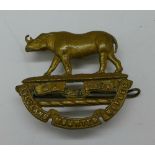 A Zululand Mounted Rifles cap badge