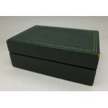A green wristwatch box,