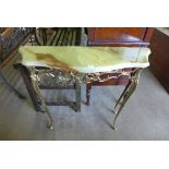 An onyx and brass console table