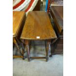 An oak barleytwist gateleg table with a revolving top