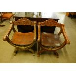 A pair of 19th Century Italian carved walnut and leather Savonarola chairs