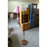 A teak standard lamp
