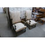 A pair of French Louis XV style carved walnut and upholstered fauteuils