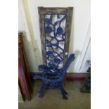 A pair of cast iron bench ends and a back plate