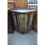 A walnut single door china cabinet