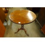 A George III mahogany circular tilt-top tripod table