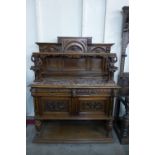 A 19th Century French carved oak and marble topped buffet