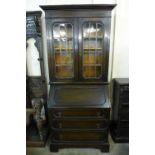 An oak bureau bookcase